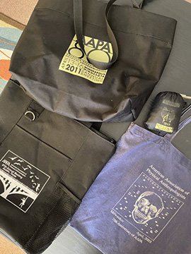 Composite of 4 tote bags from previous AABA conferences